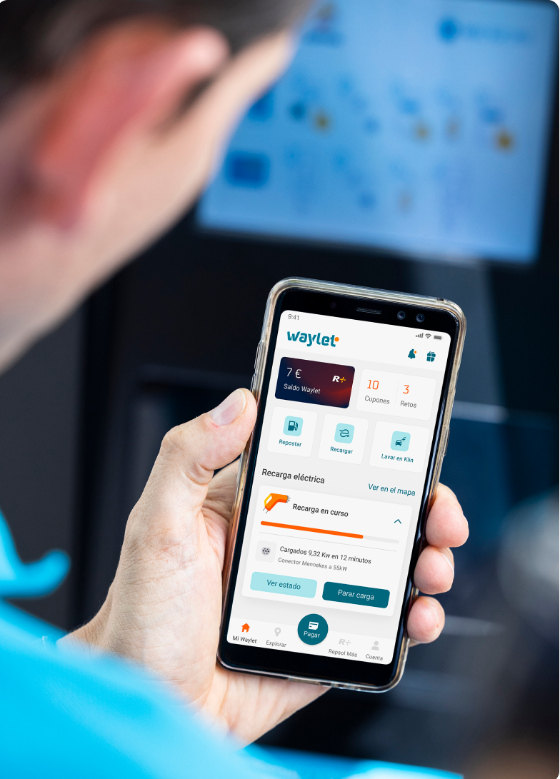 A man checking the Waylet app in the car