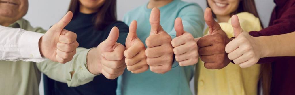 Several people with thumbs up