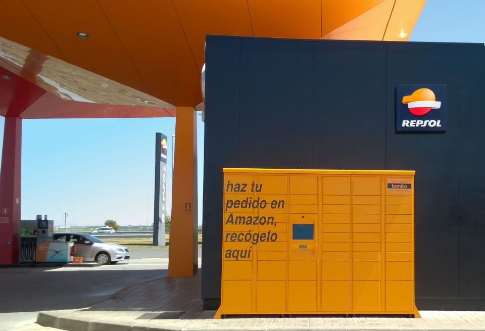 Shot of yellow Amazon lockers outside a Repsol service station 