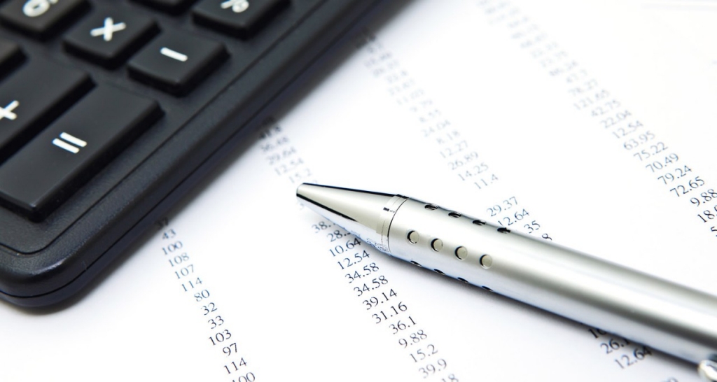 Data with pen and calculator