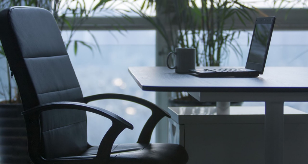 Conference room table with a laptop