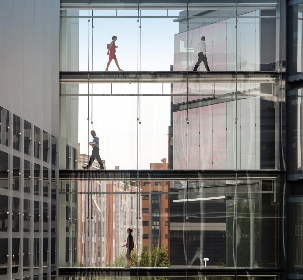 Employees walking the halls of Repsol Campus.