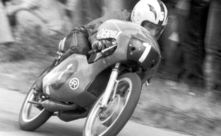 The Repsol Team, motorcycles racing in a black and white image