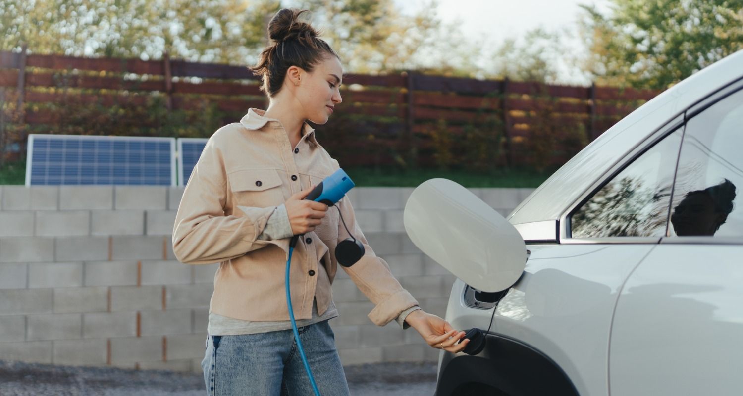 Woman with an electric car