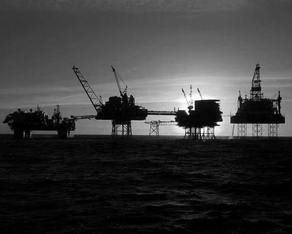 Black and white photo of platform in the sea