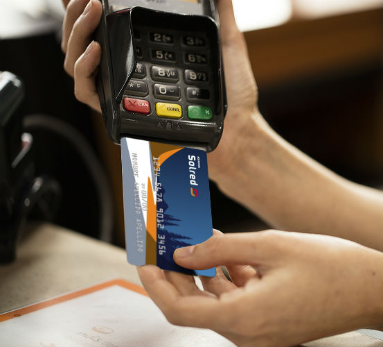 A Solred card inserted in credit card machine