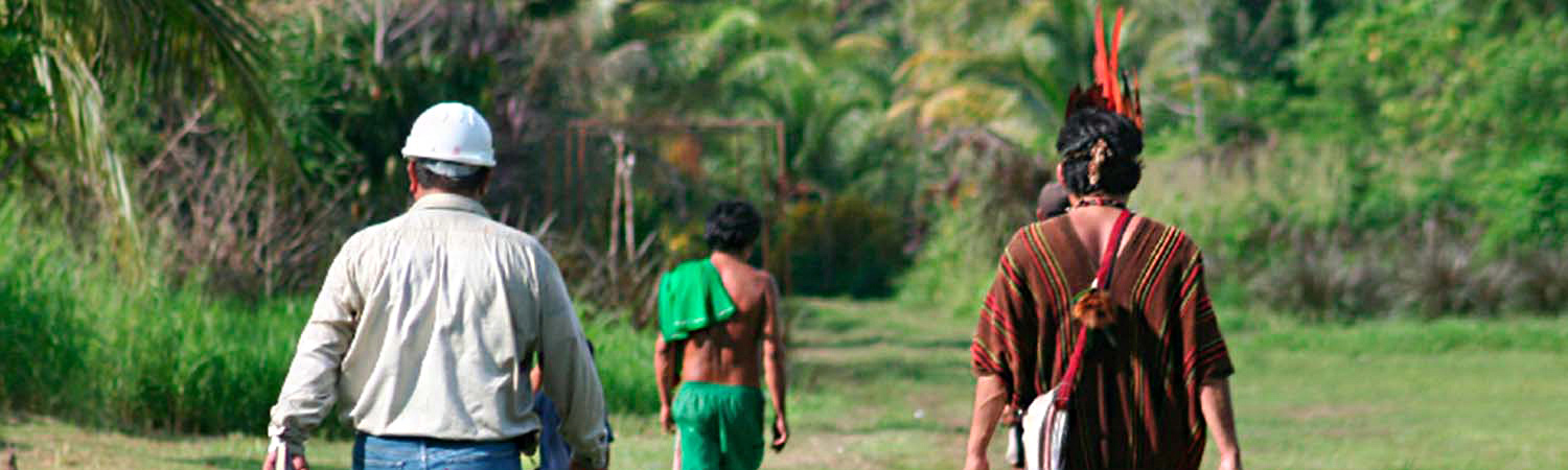 Repsol worker beside natives