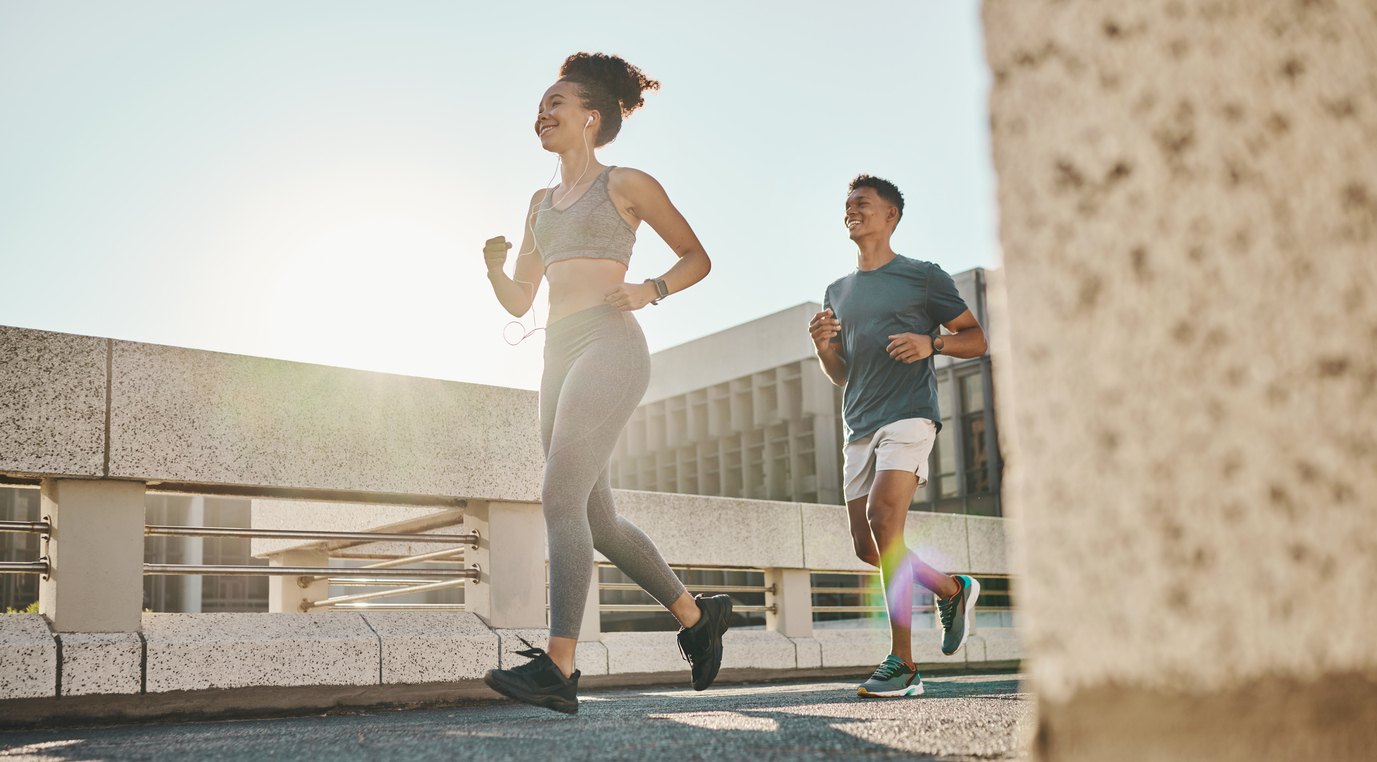 Two people running in the street