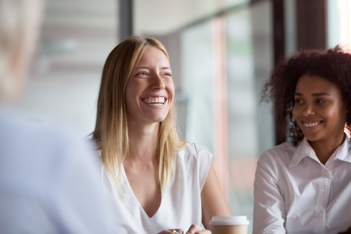 People smiling in a meeting 