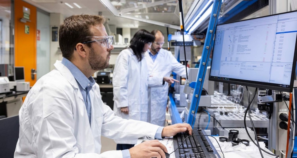 A researcher analyzing data on a screen