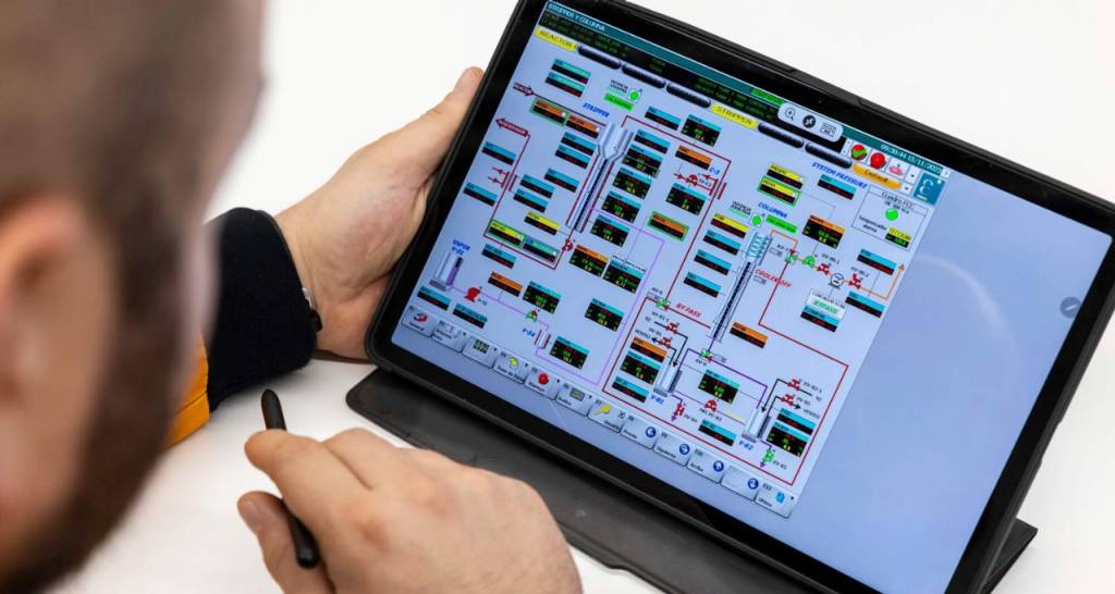 A person looking at data on a tablet