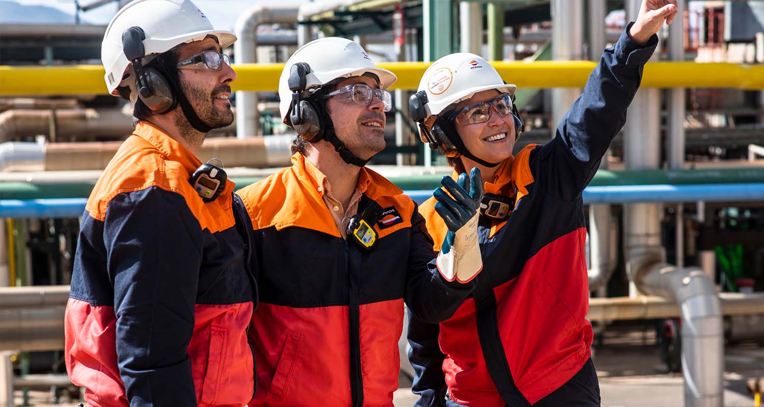 Three operators smiling