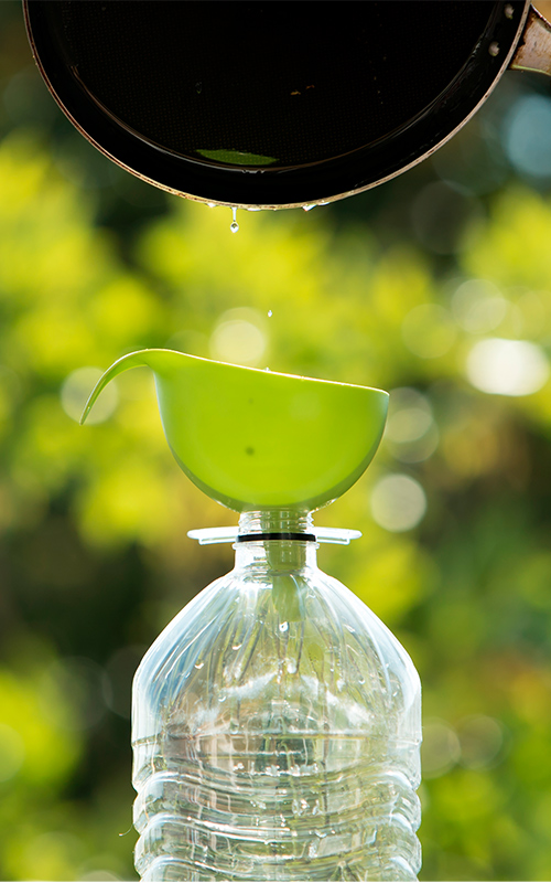 Used oil being poured into a bottle