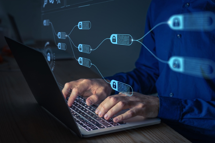 Blockchain diagram shown on a laptop