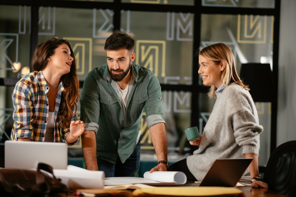 Three people working together