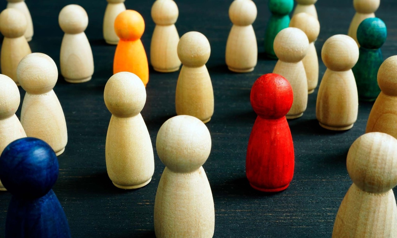 Small wooden figures representing the concept of inclusiveness and integration