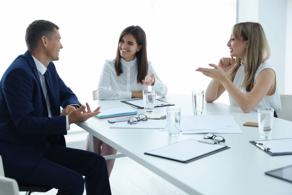 Three individuals having a conversation