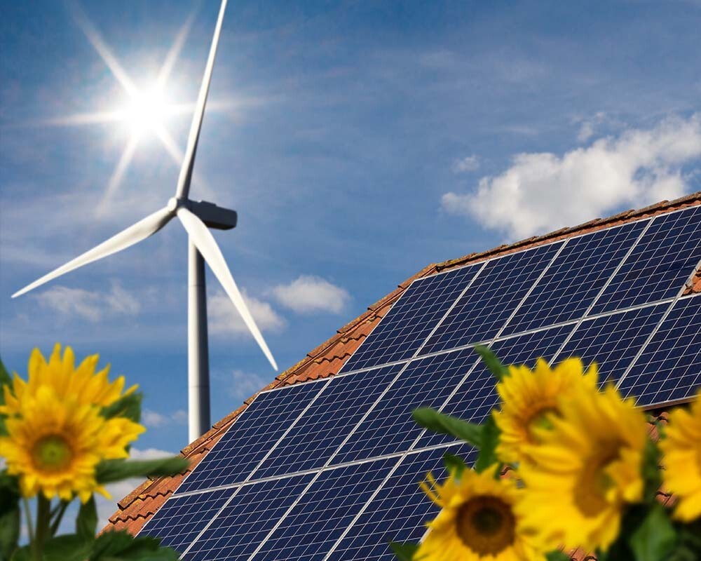 a roof with solar panels and a wind turbine