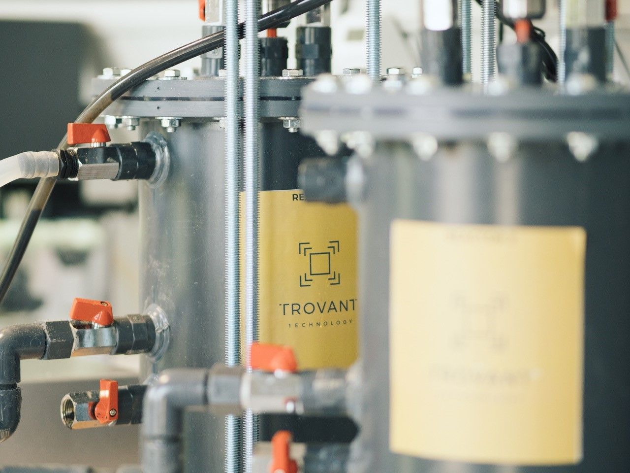 Industrial containers with the Trovant logo