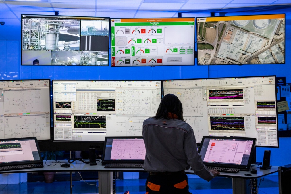 An individual looking at a various screens