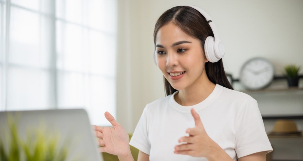 A woman talking to a computer