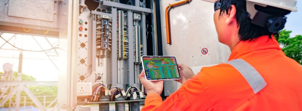 An operator performing maintenance on a machine