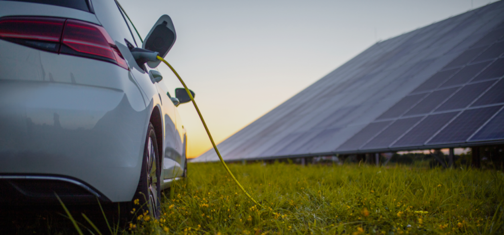 An electric car charging with a solar panel