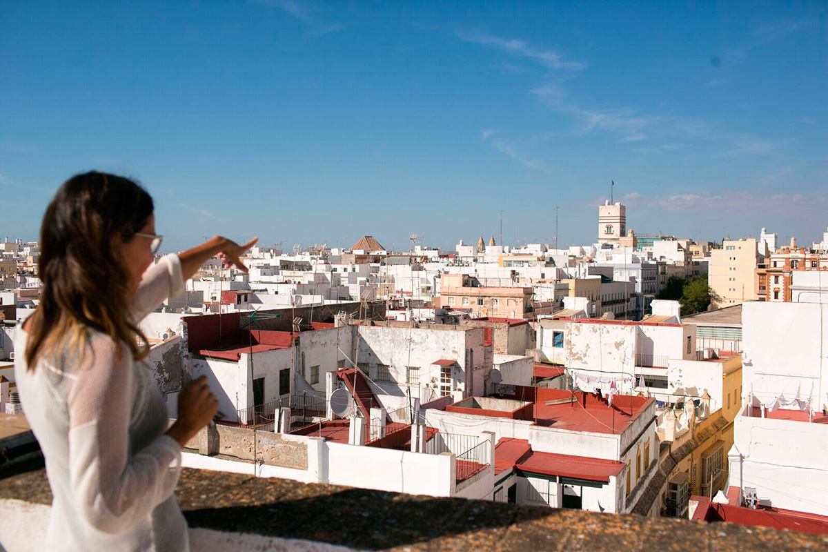 A woman on a rooftop terrace