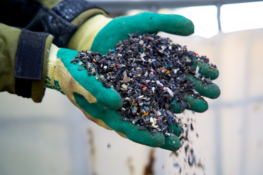 Hands holding recycled plastic chips