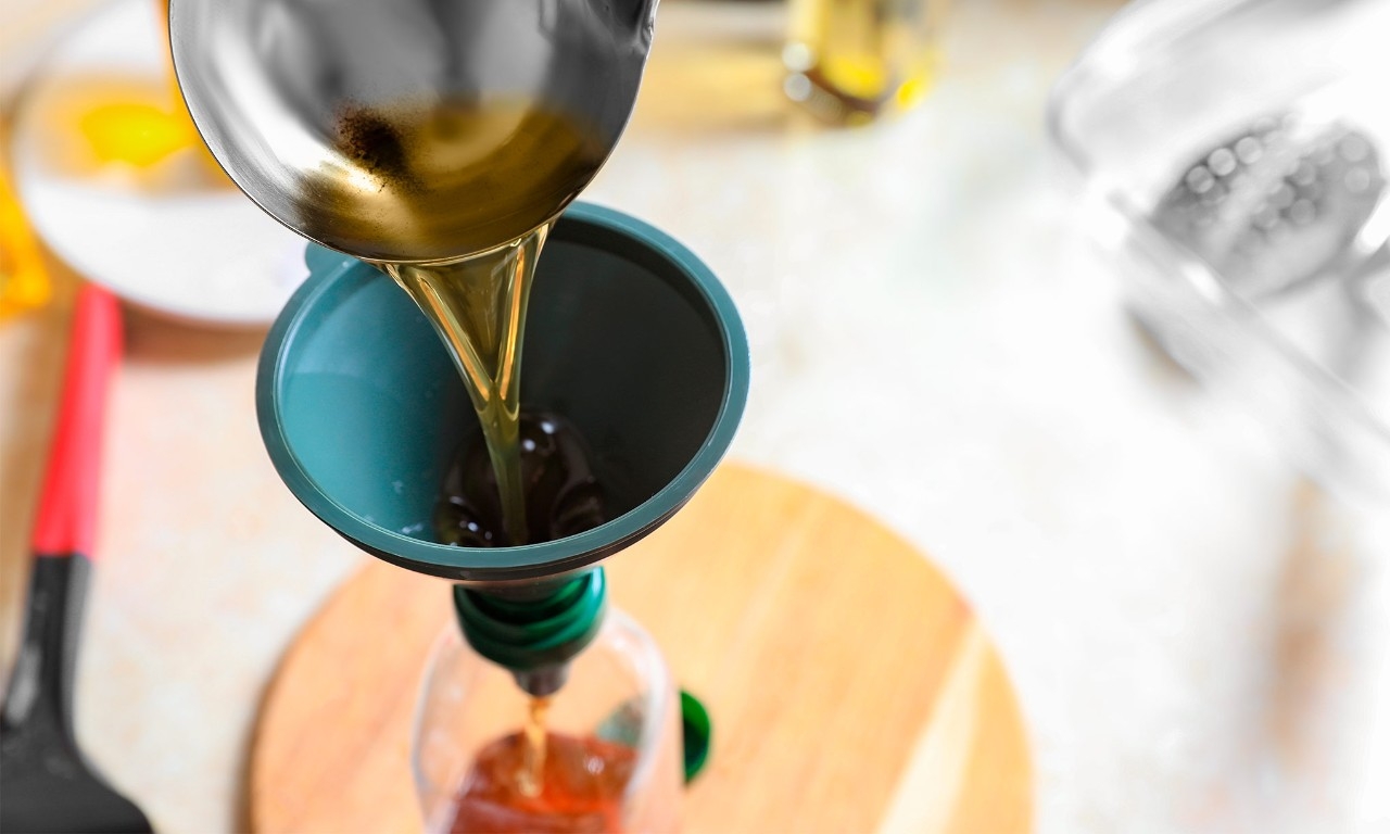 Used oil being poured into a bottle