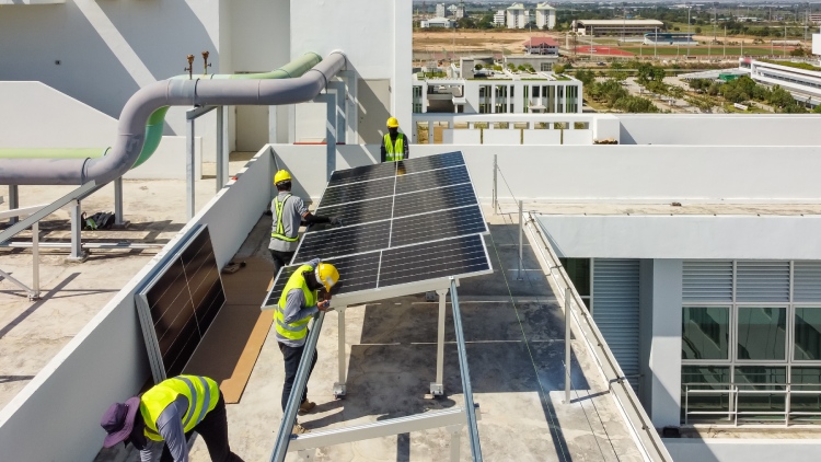 Technicians installing solar panels