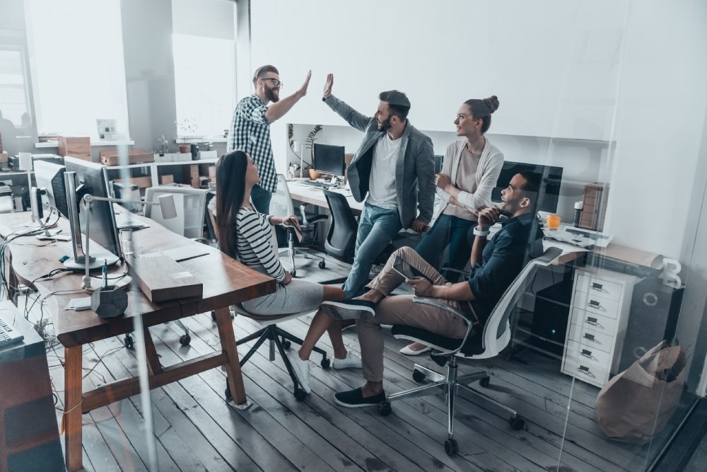 Employees having a casual chat in an office