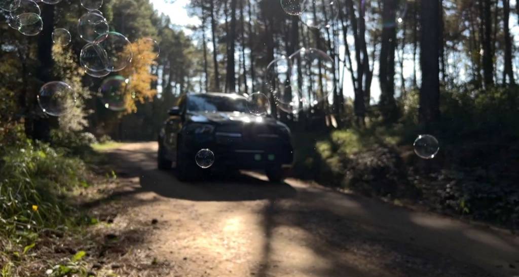 A car driving through a forest