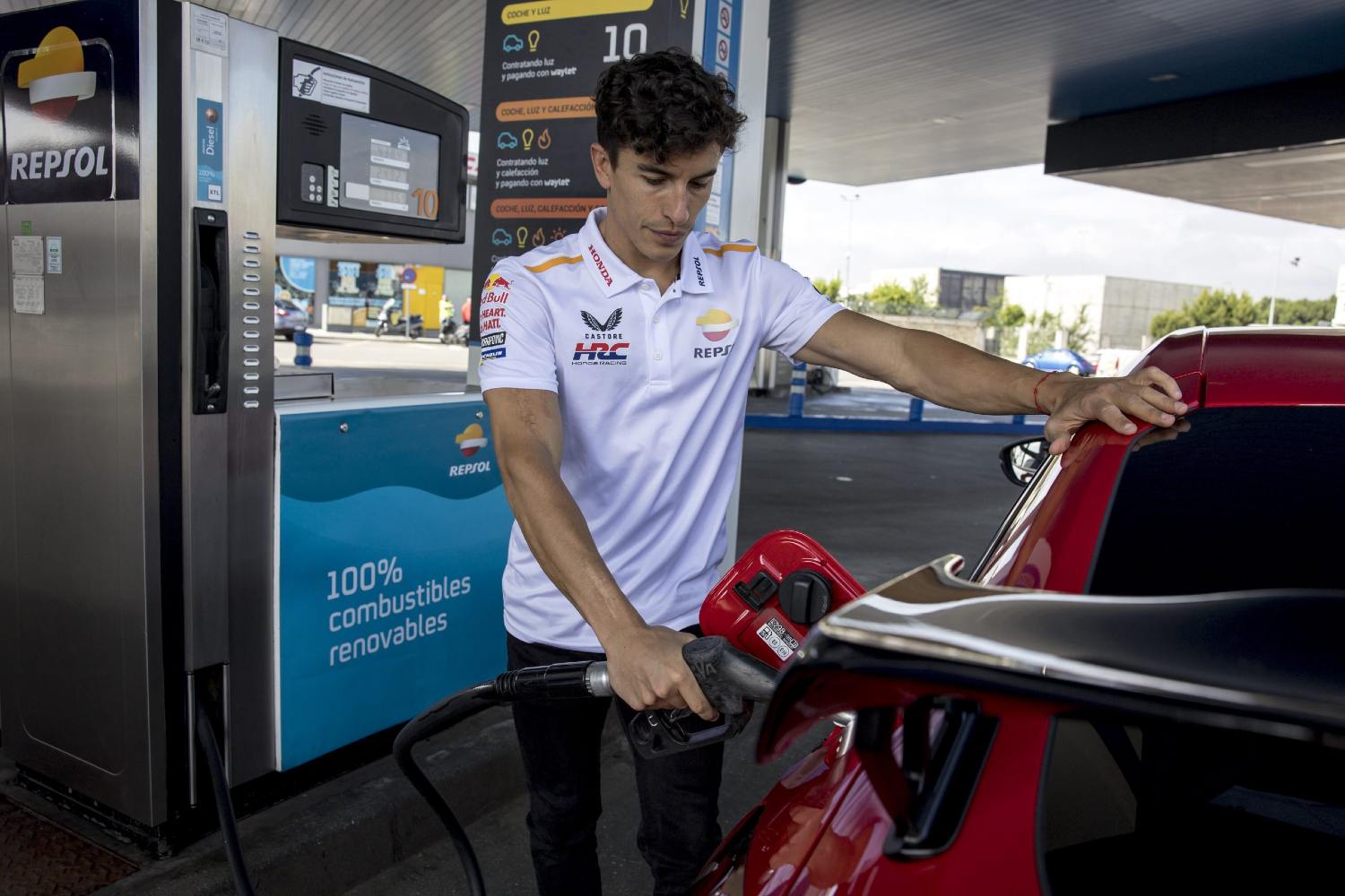 Marc Marquez refueling with renewable fuel at a Repsol service station