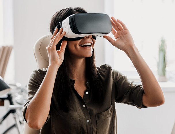 A woman trying a virtual reality headset