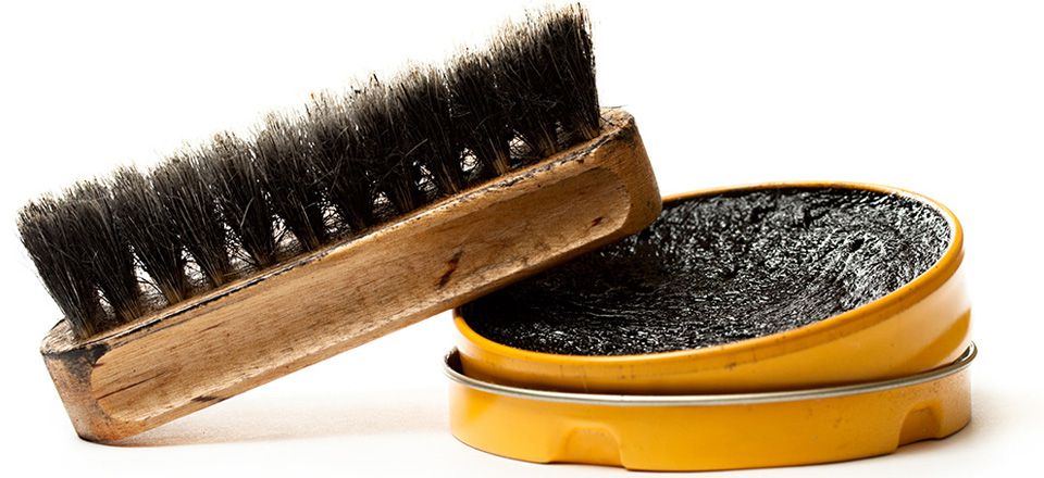 Shoe polish can and brush