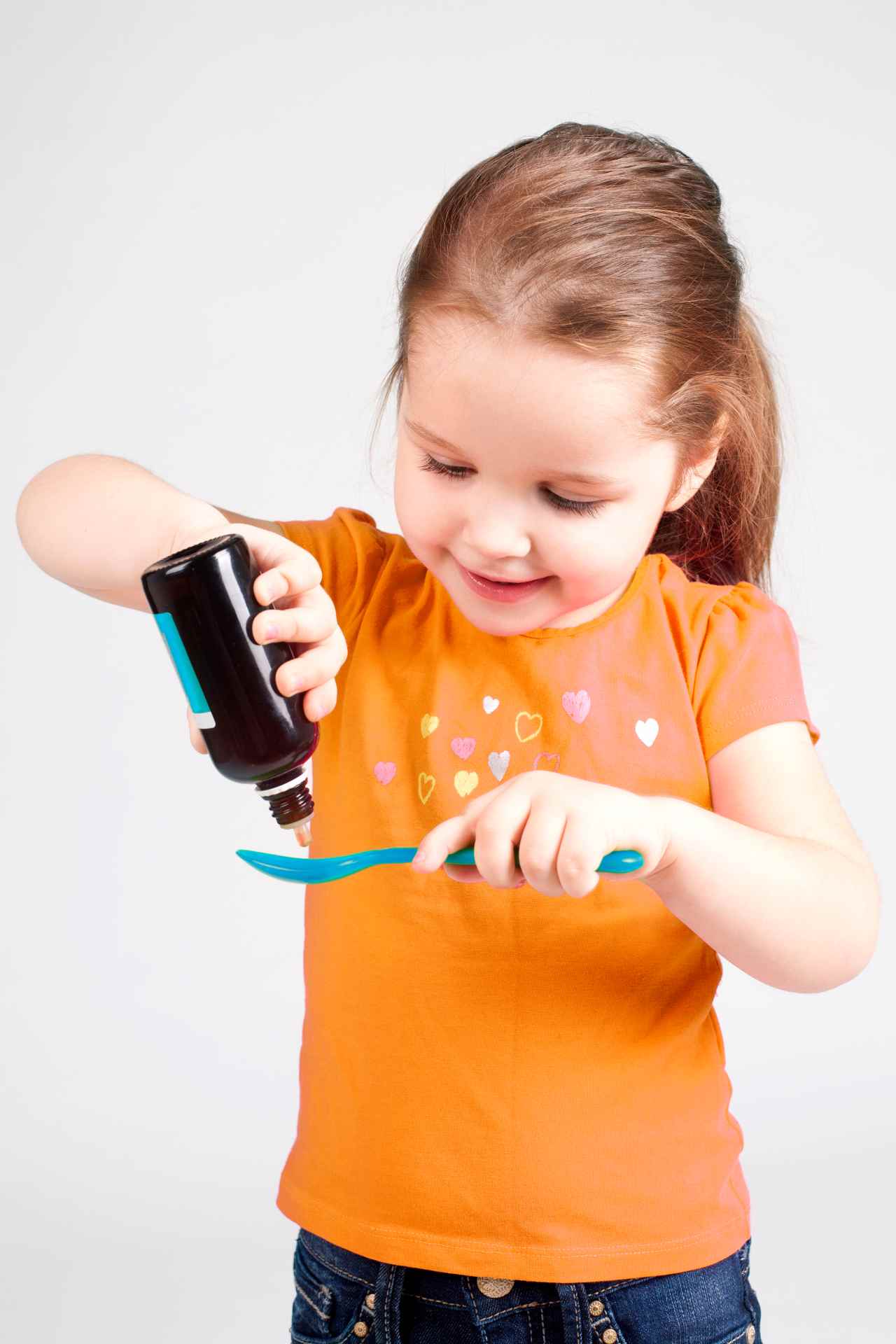 A girl taking her medicine
