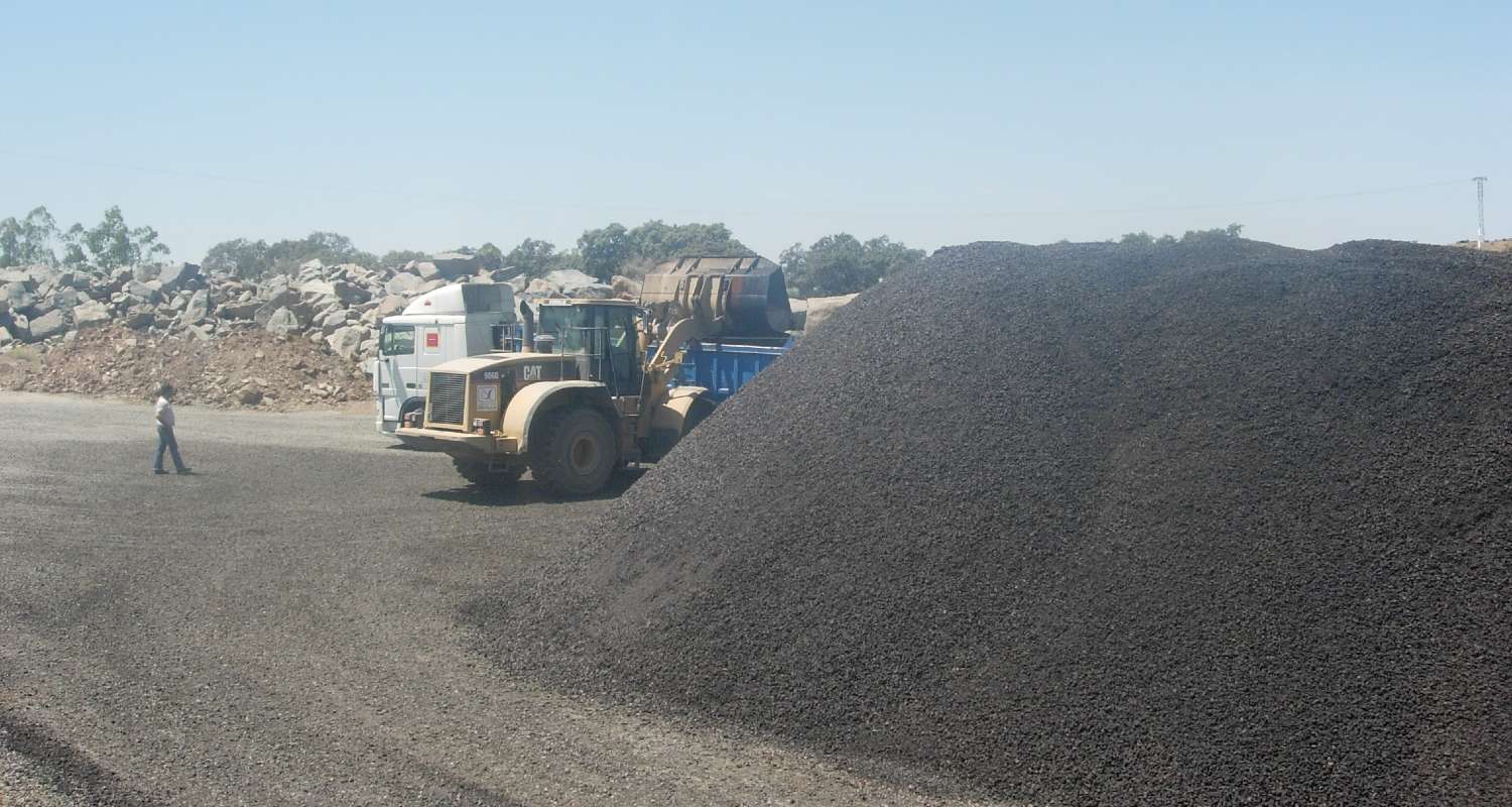 A truck with asphalt debris