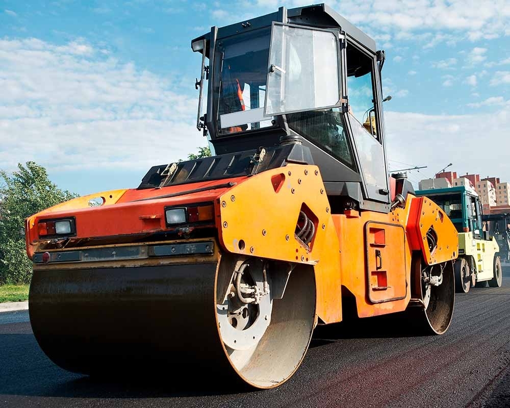 Road roller compacting asphalt