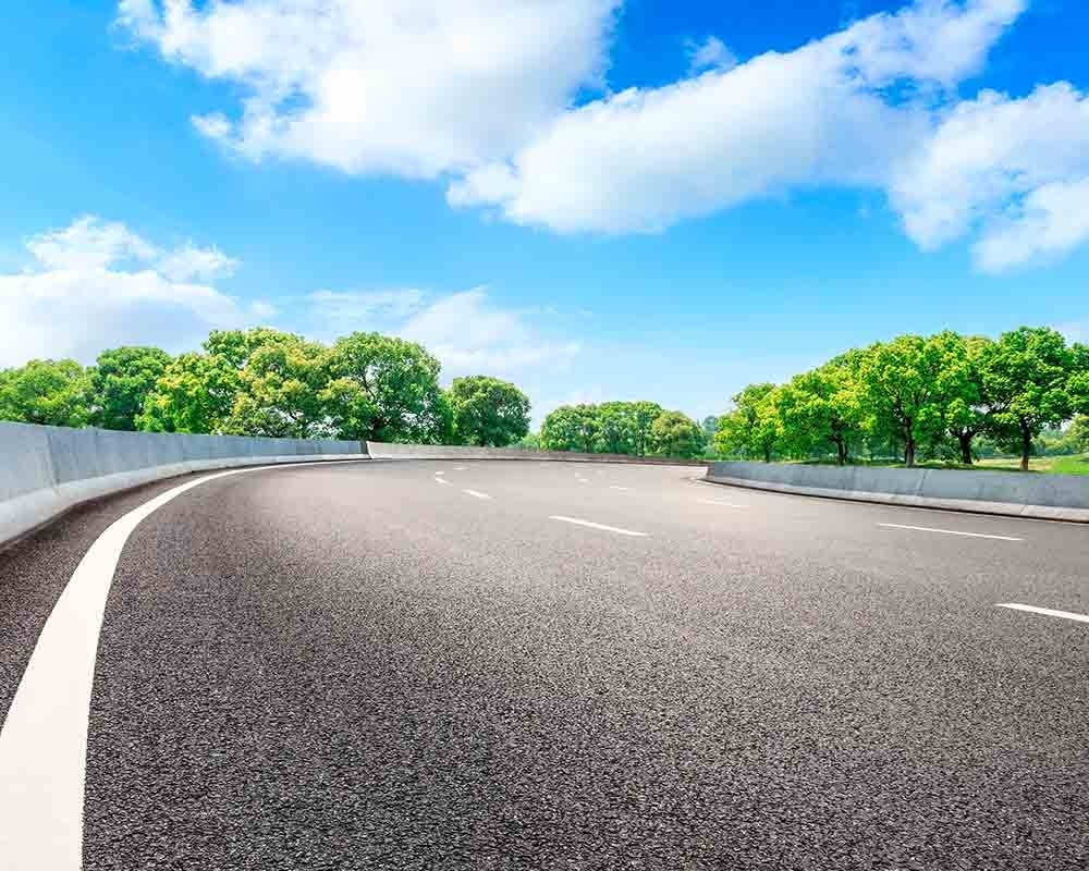 Highway with trees and blue skies