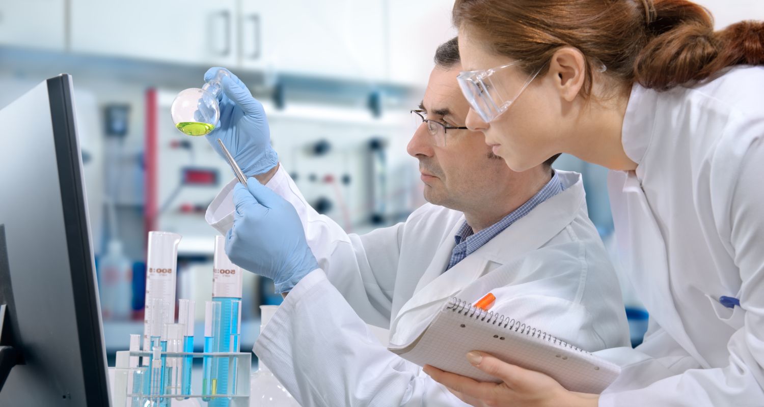 Researchers looking at a sample in a lab