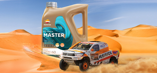Repsol racing car and a lubricant container in the desert