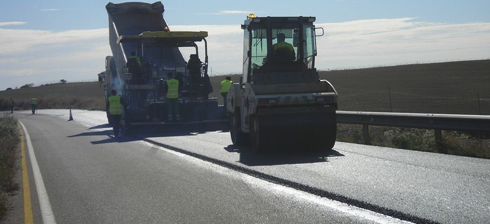 Emulsions for warm bituminous mixes. Two asphalt rollers sitting on a road