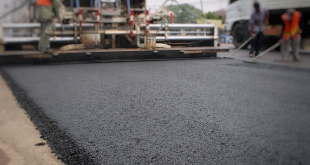 Operators working on asphalting jobs