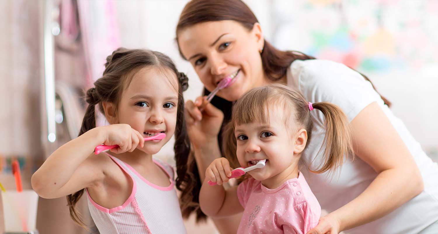 A family brushing their teeth and several dots joined by a line to make a smile