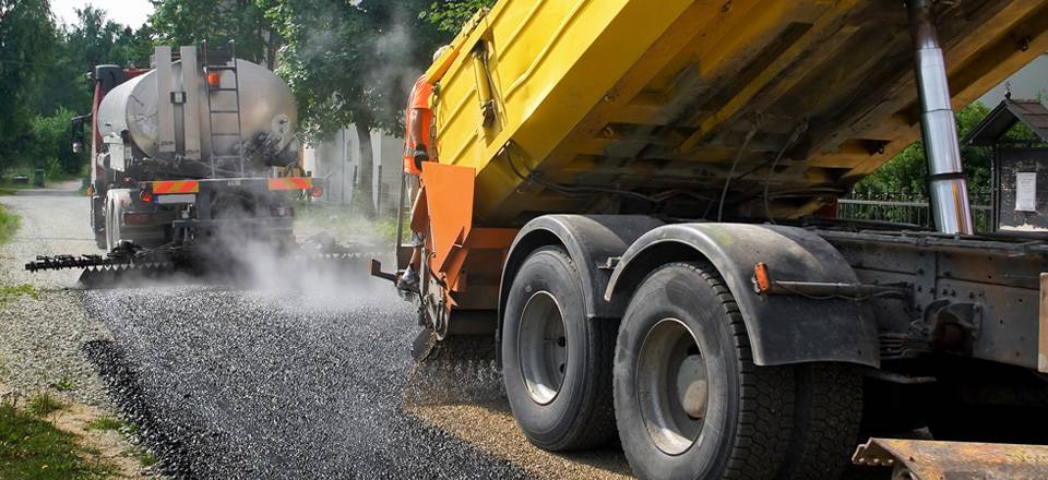 Trucks working on cold microsurfacing