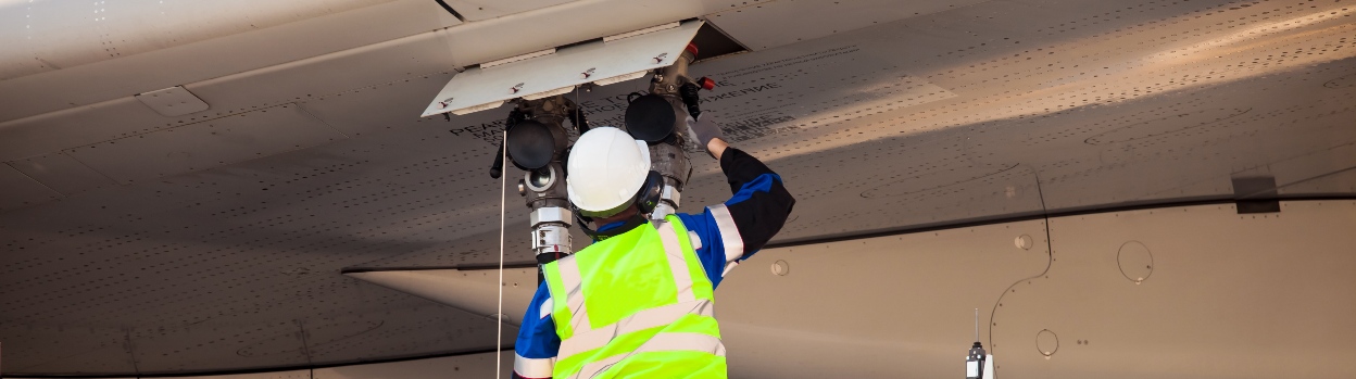 Operator carrying out maintenance tasks on an airplane