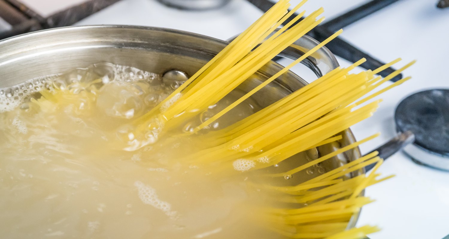 Spaghetti in a pot filled with boiling water