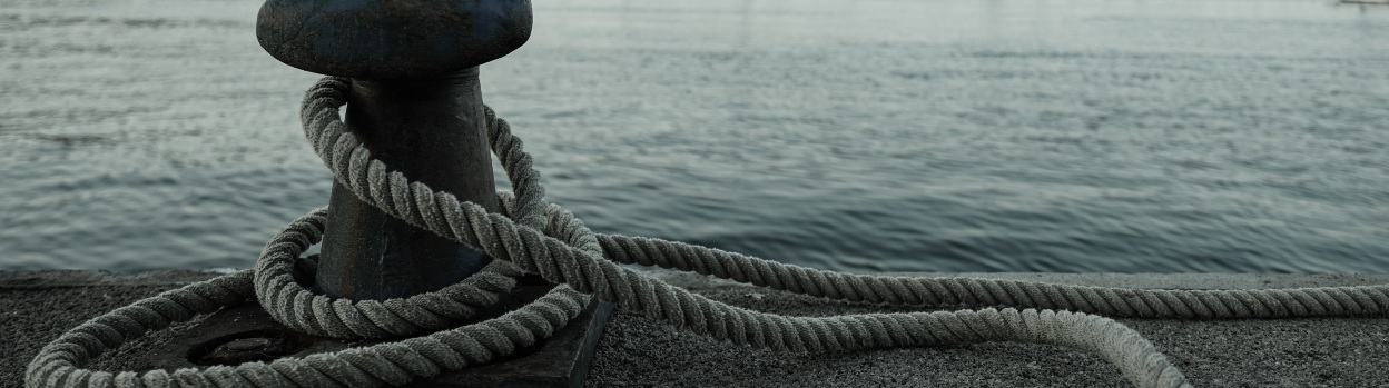 View of a bollard with a rope tied to it