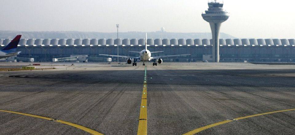 Fuel-resistant bitumen. Plane on runway